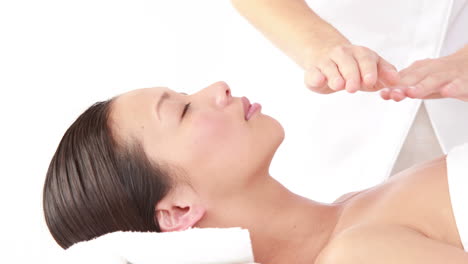 woman enjoying a reiki treatment