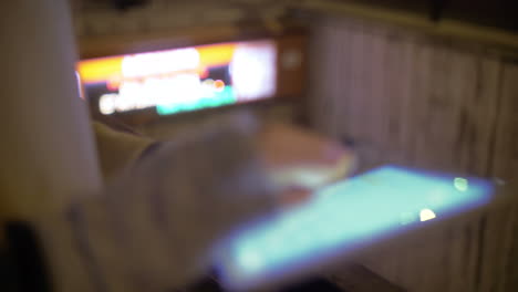 Female-hands-working-with-touch-pad-by-metro-entrance