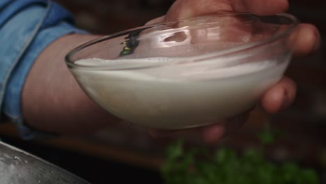 close up video of pouring cream into the frying pan