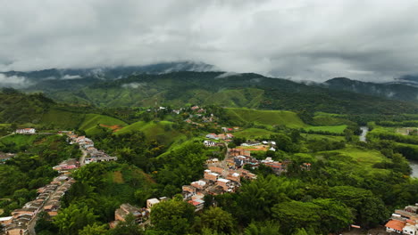 Aerial-view-over-houses-and-roads-in-the-mountains-of-San-Rafael,-cloudy-Colombia