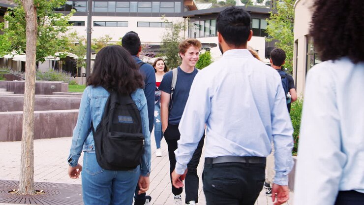 High School Students Socializing Outside College Buildings