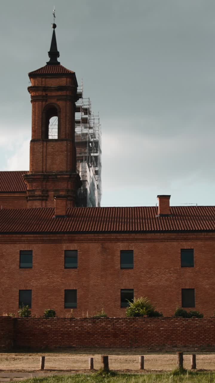 Brick Building with Tower and Scaffolding