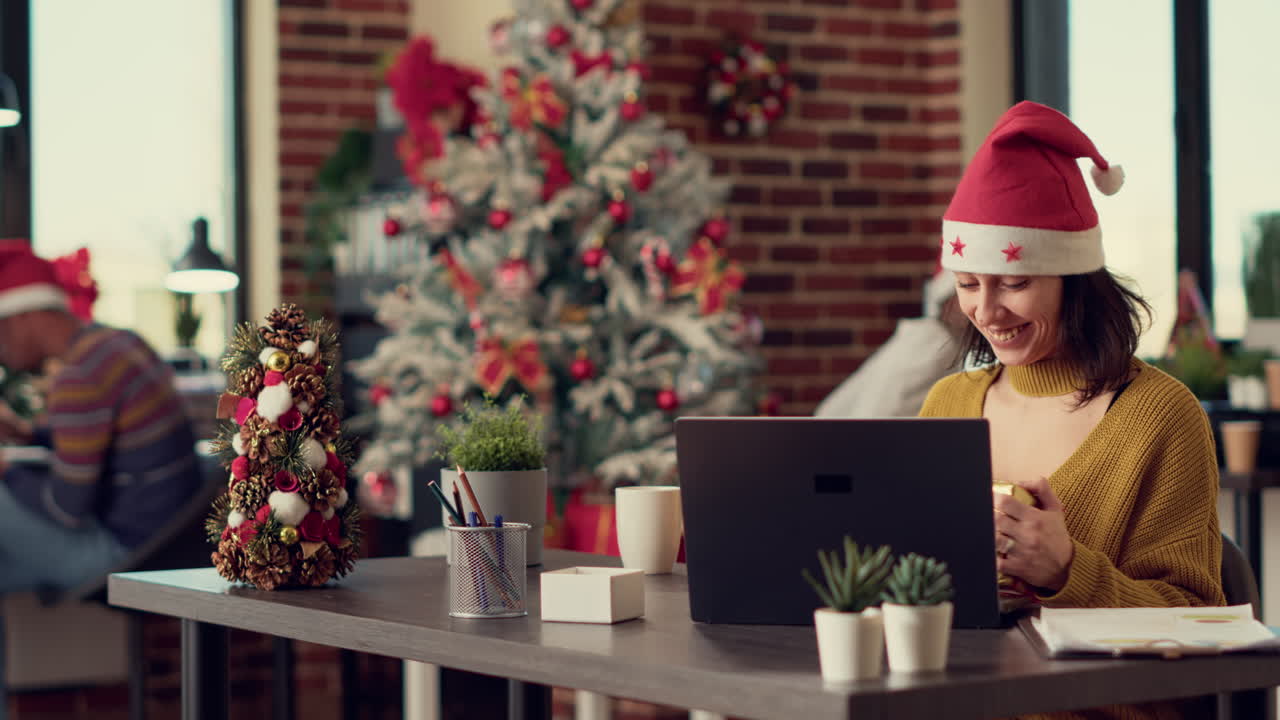 Office workers celebrating christmas eve with gifts