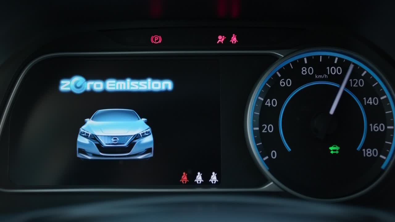Starting electric car Dashboard. Track in to the button. Finger press the button to start the car engine. Car dashboard during start engine on the darkness