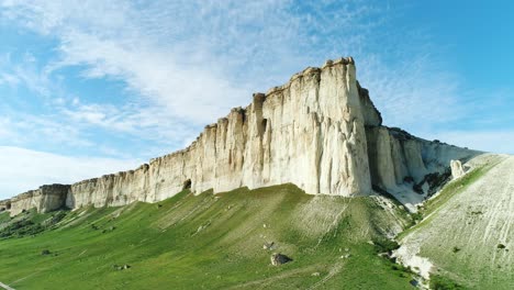 white cliffs and green valley landscape