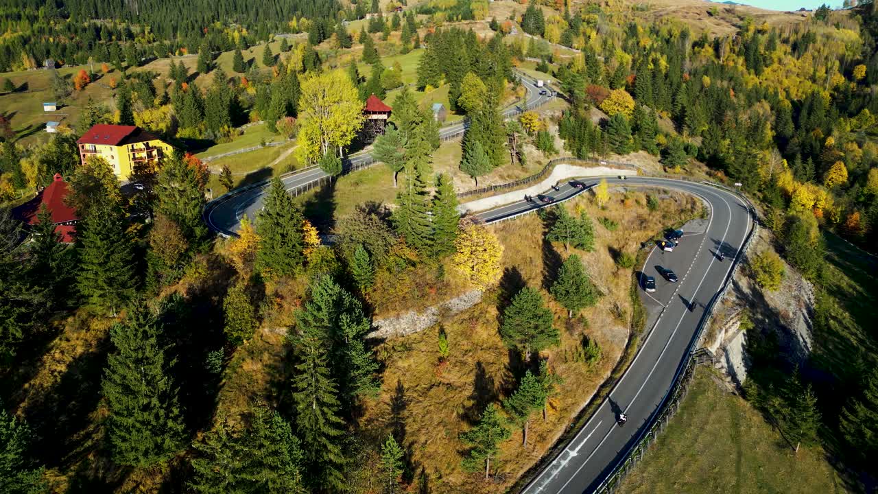 Thrill meets beauty as motorcycles speed through stunning autumn hills. Vibrant fall colours and winding roads create the perfect backdrop for an exhilarating ride in nature