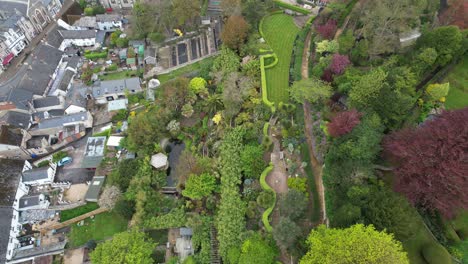 beautiful gardens and large house beer fishing village and beach devon england drone aerial view