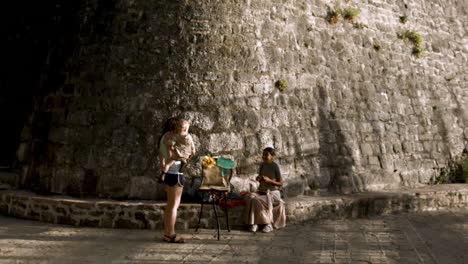 family exploring an old city with vendors