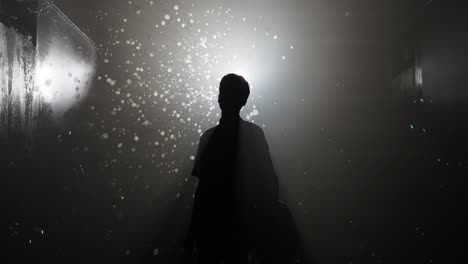 silhouette of a child in a foggy corridor