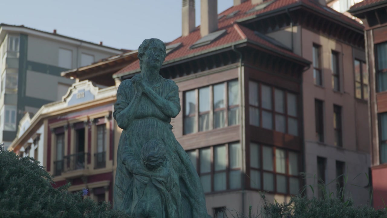 Historic statue standing in a public square surrounded by traditional buildings in Candás, Asturias, Spain. Cultural landmark reflecting the heritage and architecture of this coastal town in Spain