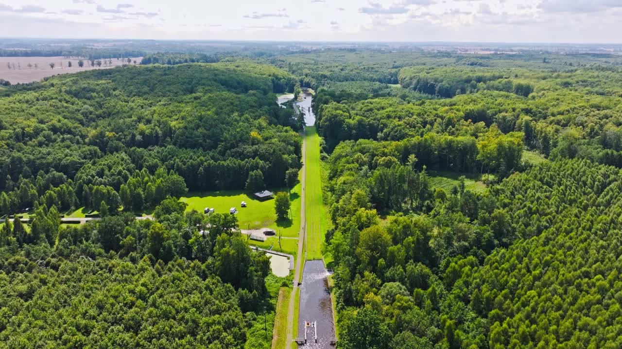 Aerial establishing of historic Buczyniec boat slipway in forested Poland region