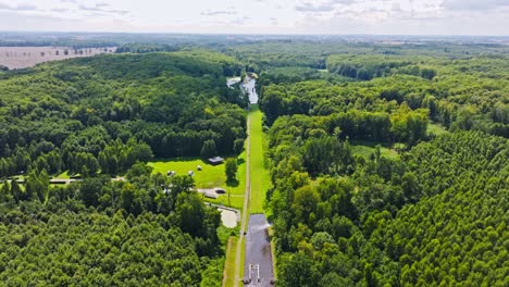 aerial establishing of historic buczyniec boat slipway in forested poland region