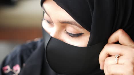 woman wearing hijab and mask