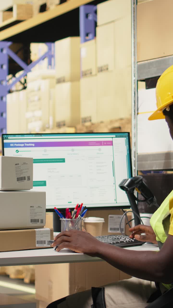 Vertical Video African american clerk uses barcode scanner to register shipment details tags
