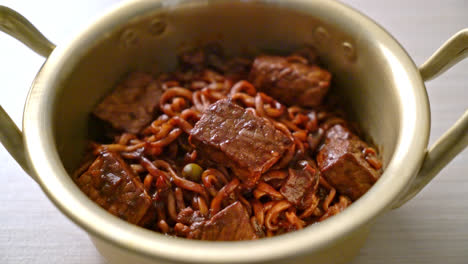 jjapaguri or chapaguri, korean black beans spicy noodles with beef - korean food style