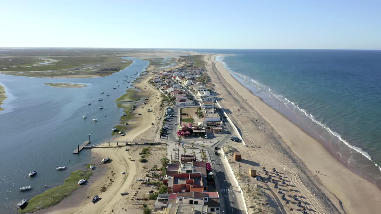 A small town on strip of land by the ocean in Portugal