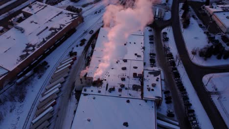 a revealing shot of the manufacturing plant in winter