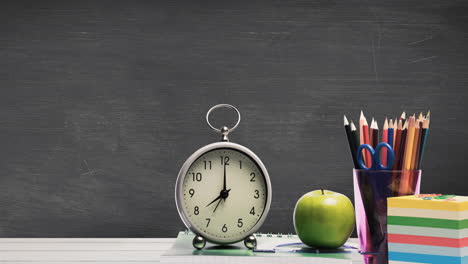 animation of school items and clock on green background