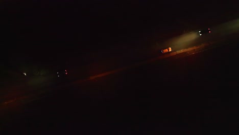 passing cars on the road at night