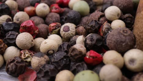 macro close-up mixed peppercorns. dry mix peppercorns close up