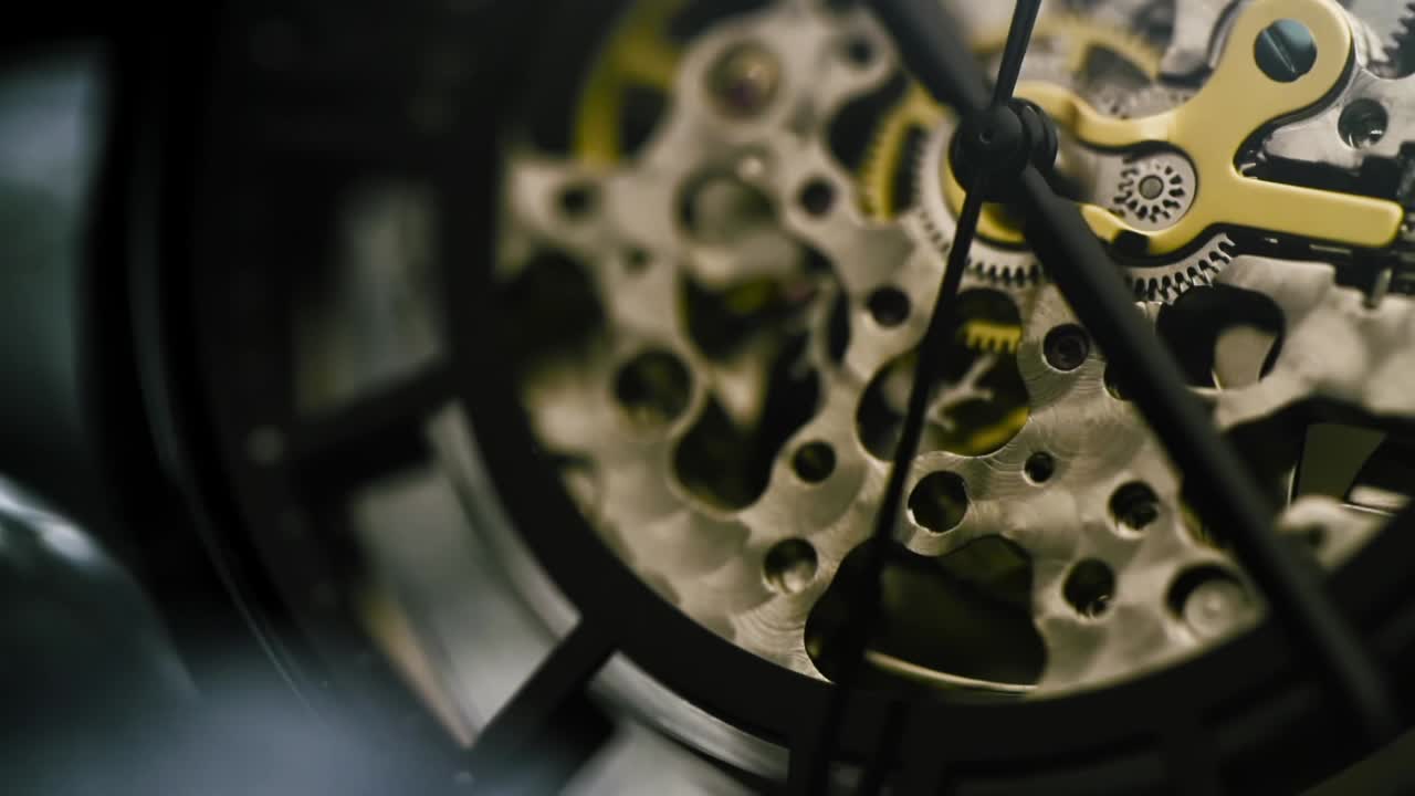 Slow motion of watch with golden elements camera, moves in and around watch at macro level