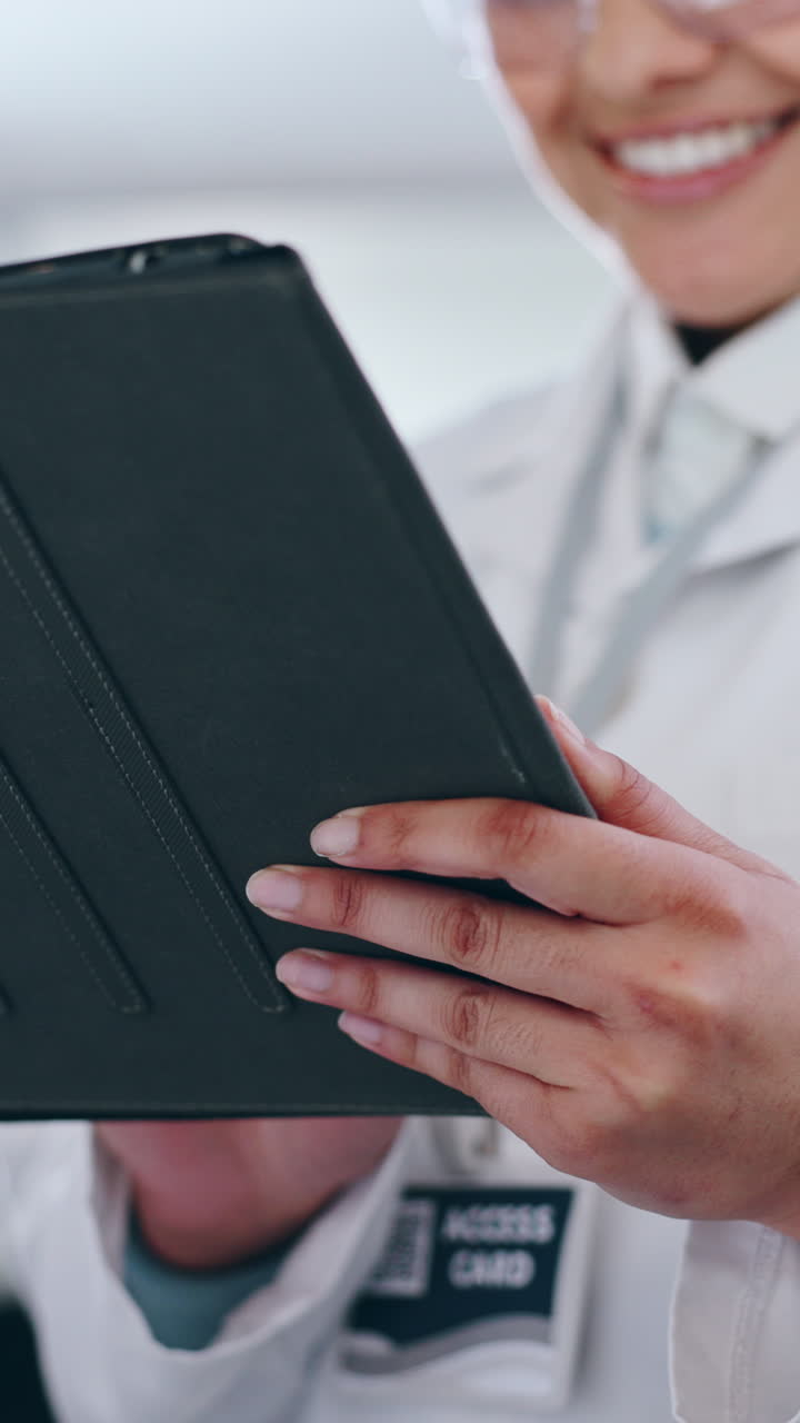 Scientist using a tablet in a lab