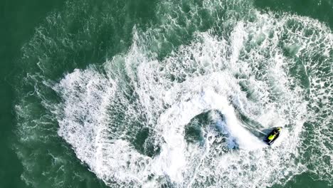 video of jet ski sea doo doing donuts on the sea