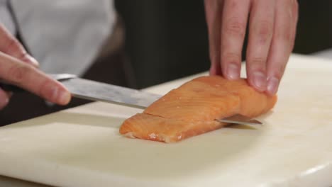 chef slicing salmon