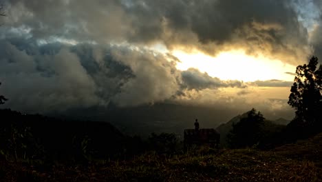 Timelapse-of-Bali's-Newest-Viewpoint-Capturing-the-Ever-Changing-Skyline-as-a-Tourist-Admires-the-Landscape-at-Lahangan-Sweet,-Indonesia