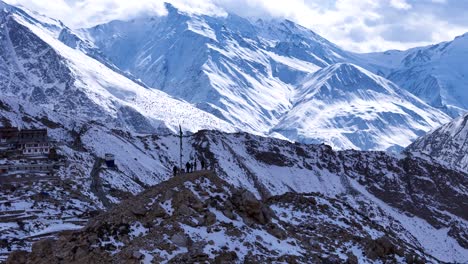 snow-capped himalayan mountains with monastery