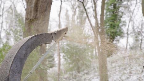 Woodchipper-Machine-Discharge-Spout-Releasing-Chopped,-Saw-Dust,-And-Wood-Chips-In-The-Forest