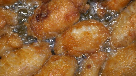 crispy fried chicken wings in hot oil