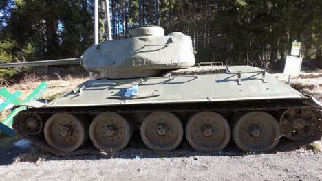 Abandoned-Soviet-T34-tank-at-the-side-of-the-road-on-the-Austrian-Slovenian-border-from-a-side-view