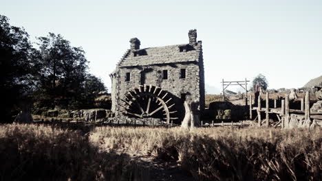 ancient stone watermill ruins in a rural setting