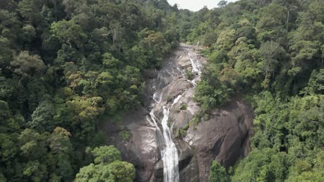 Thin-but-powerful-waterfall-cascades-down-granite-wall-in-Malaysia