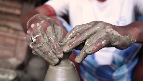 traditional diya made of clay and mud placed in sunlight at diya factory in rural india.