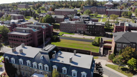 aerial: moving backwards from sir howard douglas hall on the university of new brunswick fredericton campus