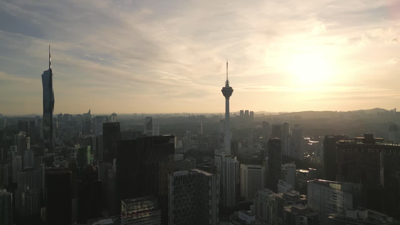 Aerial panoramic view of iconic skyline towers surrounded by city skyscrapers at twilight, urban scene unfolds