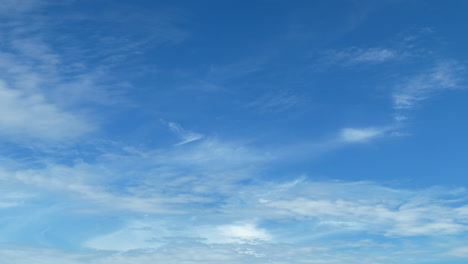 white puffy clouds and a blue clear sky timelapse