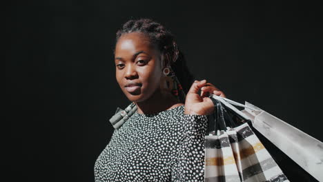 portrait of beautiful black girl with shopping bags