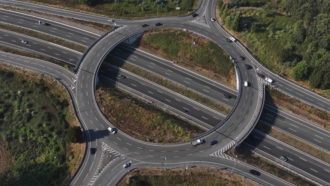 Highway roundabout with cars going on multiple directions
