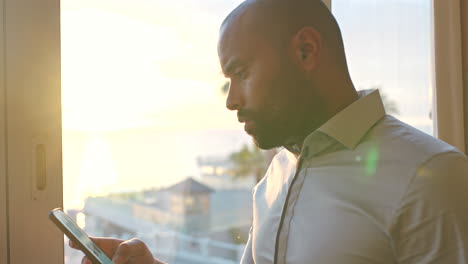 Businessman,-phone-or-thinking-by-window