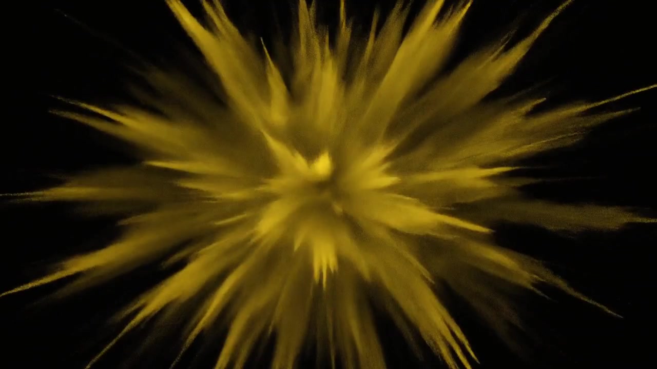 Výbuch žlutého prášku na černém pozadí