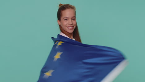 girl waving european union flag, smiling, cheering democratic laws, human rights freedoms in europe