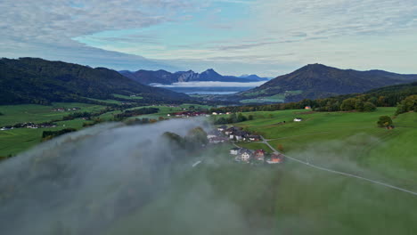 aerial lateral shot of a small town in a beautiful natural landscape