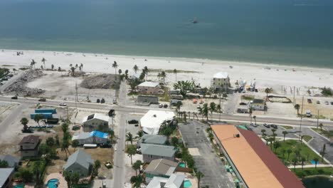 Sandy-beach-and-Gulf-of-Mexico-Pan-Up-in-Fort-Myers,-Florida-in-USA-filmed-by-drone