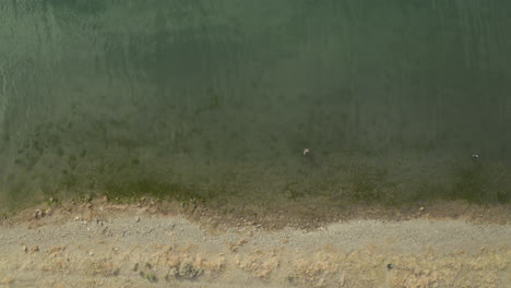 Bird's-Eye-View-Aerial-Footage-of-Fisherman-at-Pyramid-Lake-in-Nevada,-USA