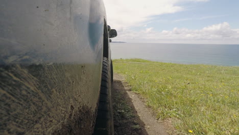 driving offroad in dirt and mud by the ocean