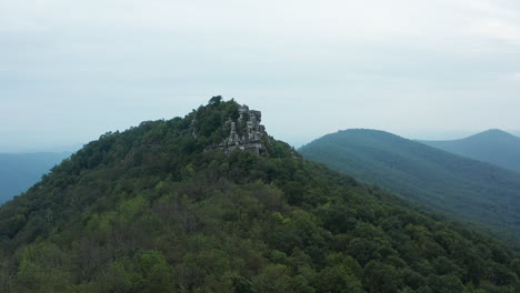 an aerial shot of big schloss and great north mountain in the evening in the summer, located on the virginia-west virginia border within the george washington national forest