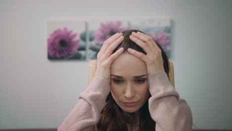 business woman hand on head. close up of stressed woman face